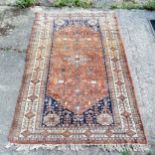 Hand woven Brown & blue grounded Middle Eastern rug with large central medallion ~ 192cm x 124cm and