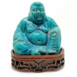 Chinese Republic period blue glaze seated Buddha on hardwood carved stand - total height 24cm with