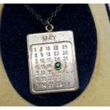 Silver calendar pendant with green stone on May 25th on a silver chain