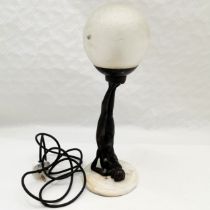 Art Deco style bronzed resin figure of a lady balancing a ball on her feet, on marble base, with