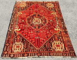 Brown/Red ground rug with central medallion, 156 cm wide, 246 cm length, in good condition.