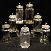 Seven assorted glass sweet jars of varying sizes, largest, 37 cm high, most having slight rim chips.