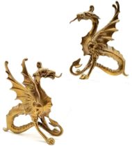 Pair of antique cast brass wyvern dragons with glass eyes. 15cm high. 1 missing eye otherwise in