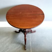 Antique mahogany circular tilt top occasional table, split top, on turned column with tripod base on