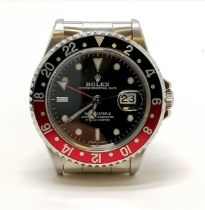 Rolex GMT - Master II Oyster perpetual date stainless steel gents wristwatch with a "Coke" red/black