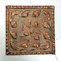 Arts and Crafts copper plaque decorated with Cala Lilly's, 48 cm square, in good condition.