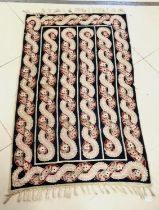 Vintage crewel work rug with all over red and blue floral decoration. 90 cm wide 160 length. with