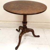 Antique oak tilt top circular occasional table on turned column on tripod base, ring marks to top,