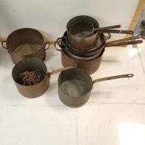 Collection of assorted Antique copper pans of varying sizes, t/w 2 assorted chains.
