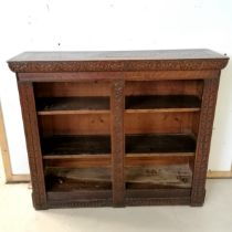 Antique oak carved decorated bookcase, fitted with 2 adjustable shelves, 108 cm wide, 32 cm deep, 90