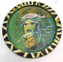 1975 large studio pottery charger with head decoration signed JP - 42.5cm diameter - some slight