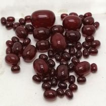 Unstrung cherry amber graduated beads - largest bead @ 3cm long & total 83g