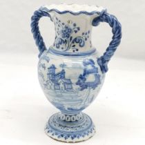 Blue & White tin glazed vase with rope twist handles, decorated with house scene on 1 side, and