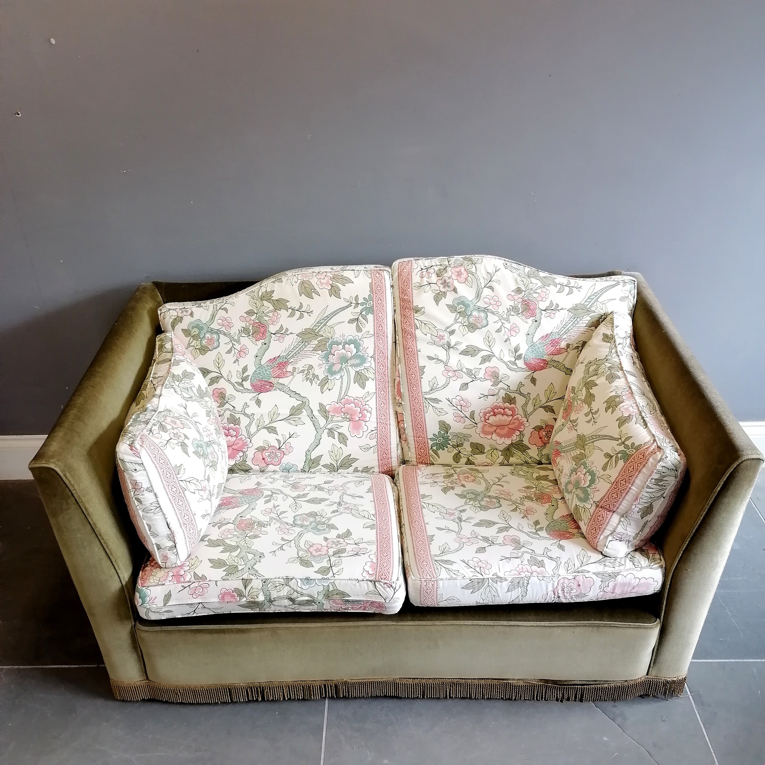 Knowle style 2 seater settee, upholstered in a green plush with Jane Churchill floral and exotic