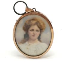 Antique hand painted portrait miniature of a lady in a gilt metal oval frame - 6cm drop