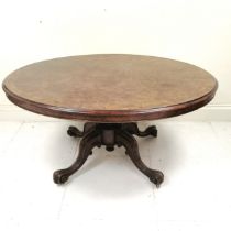 Victorian walnut oval tilt top centre table, on carved centre pedestal, carved cabriole legs with
