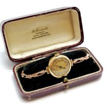 9ct gold J W Benson (London) manaul wind ladies wristwatch on a marked 9ct rose gold sprung bracalet