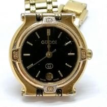 Gucci ladies quartz wristwatch #9200L with black dial and gold plated finish - will need battery and