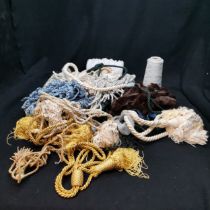 Job lot of curtain ties lace and a cone of cotton and lace.