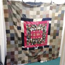 WWI wool patchwork cover with Hereford uniform badges and other badges. In mostly good condition,