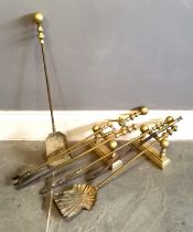 Vintage brass fire irons, and another set similar, t/w pair of brass fire dogs.