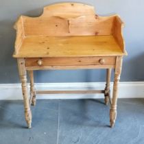 Antique pine washstand with shaped gallery rail, single frieze drawer on turned column supports,