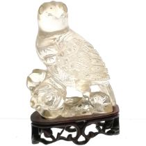 Oriental carved rock crystal figure of a bird of prey on a hand carved wooden stand - total height