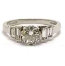 2000 Platinum hallmarked brilliant cut diamond ring with baguette diamond set shoulders by G