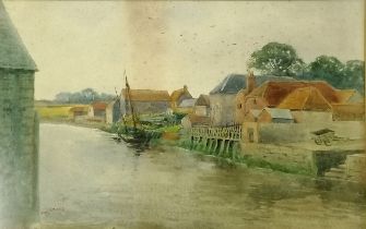 Framed watercolour painting (dated 1895) of village next to river by Henry Stannard (1844-1920) -