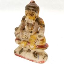 Carved stone figure of the Monkey King, with hand painted highlights, 12.5 cm high, 8 cm wide.