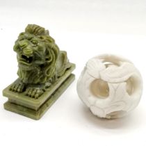Carved green stone statue of a recumbent lion (15cm x 12cm high) t/w Oriental carved hardstone