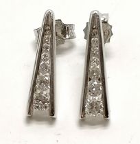 18ct hallmarked white gold pair of earrings channel set with graduated diamonds (14 in total) by