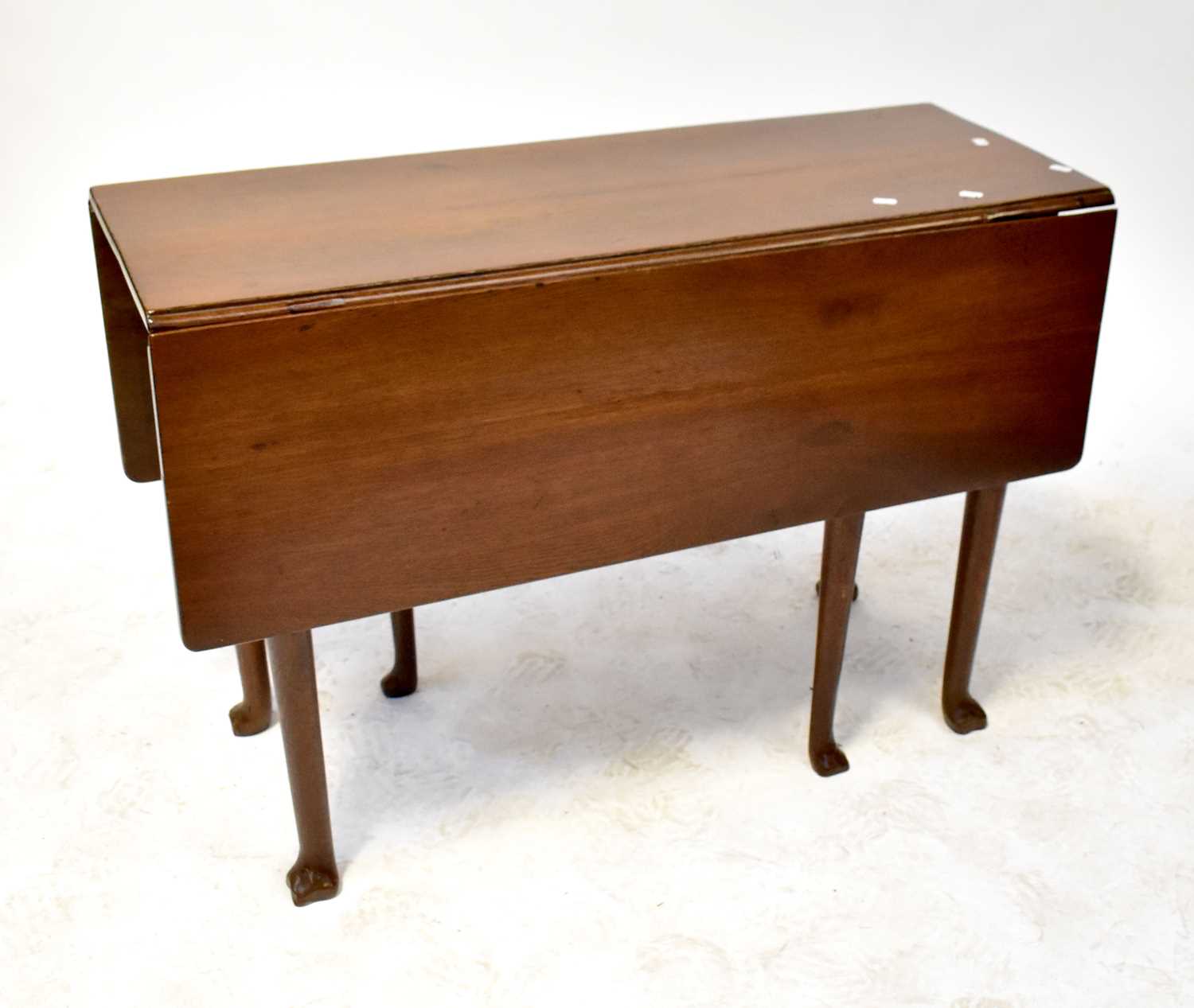 A 19th century mahogany dropleaf table to tapering supports and paw feet, when extended 114cm.