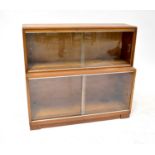 A two-section stacking bookcase with sliding glass doors, height 80cm, length 89cm, width of top