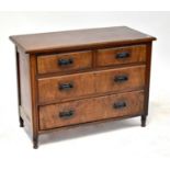 An early 20th century walnut chest of two short over two long drawers, raised on turned supports,