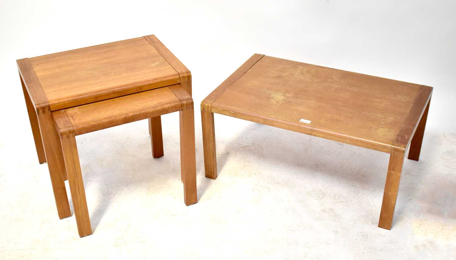 A nest of three light oak tables, the largest 36 x 80 x 54cm.36 x 80 x 54cm