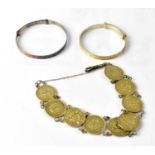 Two sterling silver children’s bangles and a silver coin bracelet (3).