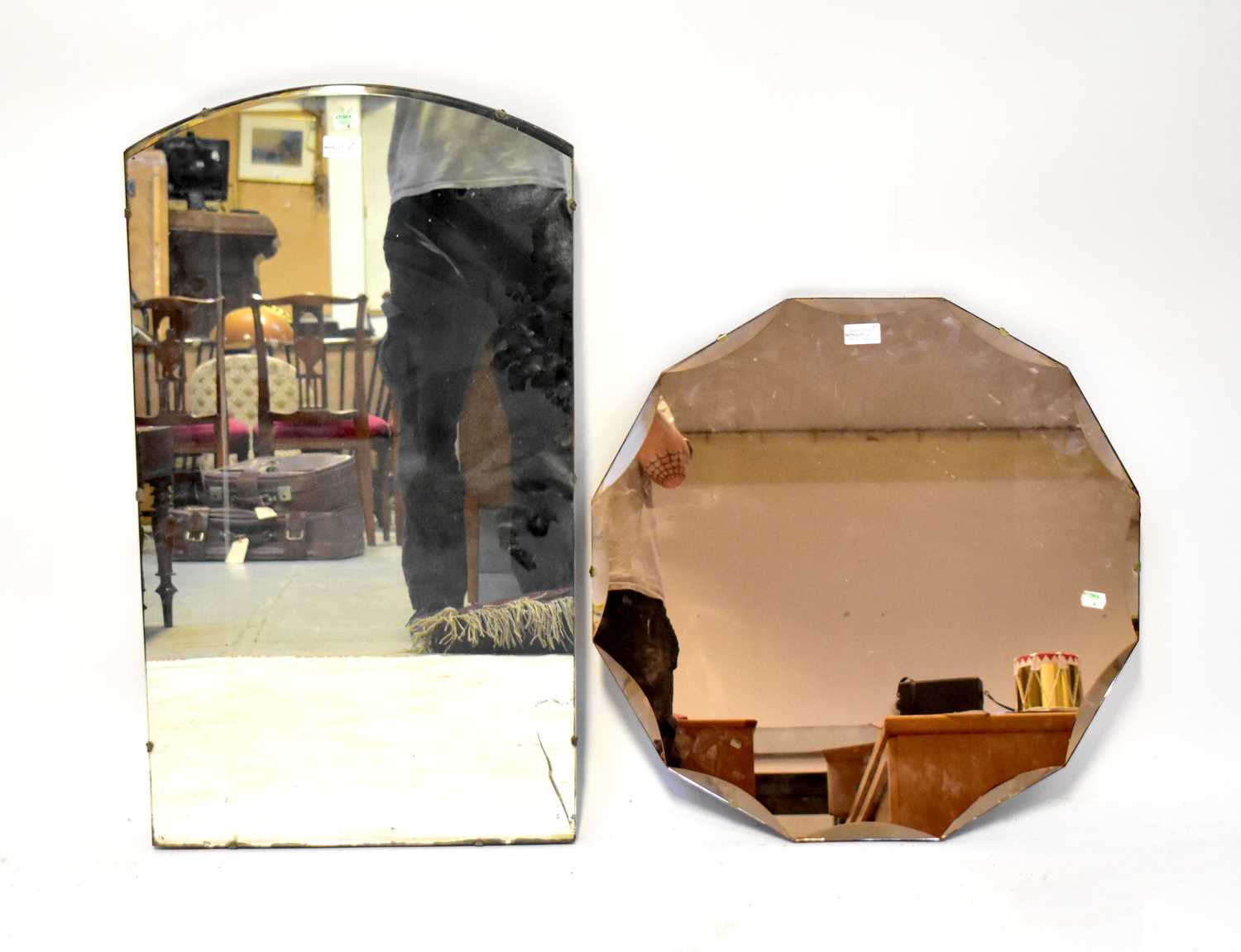 A 1940s shaped peach glass wall mirror, diameter 59cm, also a rectangular mirror plate with simple - Image 2 of 2