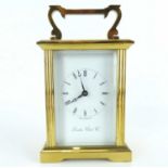 LONDON CLOCK COMPANY; a brass carriage clock, the white enamelled dial set with Roman numerals,