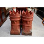 A pair of King Pottery chimney pots painted ironstone red, height of each 76cm (2).Height of each