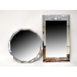 A 1940s shaped peach glass wall mirror, diameter 59cm, also a rectangular mirror plate with simple