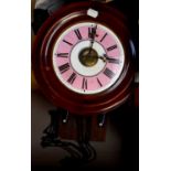 A late 19th/early 20th century mahogany postman's alarm wall clock, the pink and white enamel dial