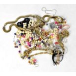 A quantity of costume jewellery to include faux pearl necklaces, charm bracelets, etc