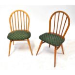 ERCOL; a set of four stick back Windsor chairs with padded seats (4).Qty: 4