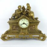 A modern Italian Imperial gilt metal mantel clock with romantic couple scene to the top, barrel