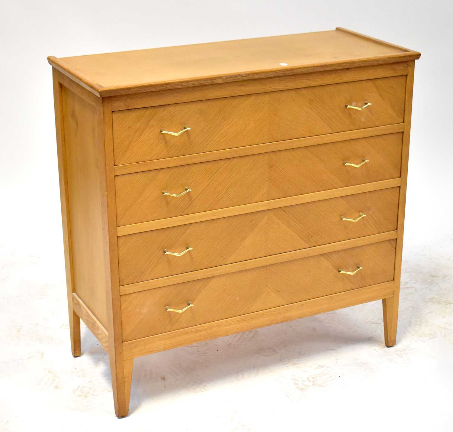 A retro oak veneered four-drawer chest raised on tapering stile supports, 91 x 92 x 41cm.91 x 92 x