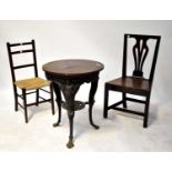 An early 20th century cast iron garden table with caryatid supports to outswept paw feet,