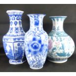 Three modern Chinese/Oriental porcelain vases, the tallest with hexagonal sides painted with