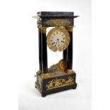 A Victorian ebonised and gilt metal mounted mantel clock, the dial set with Roman numerals and