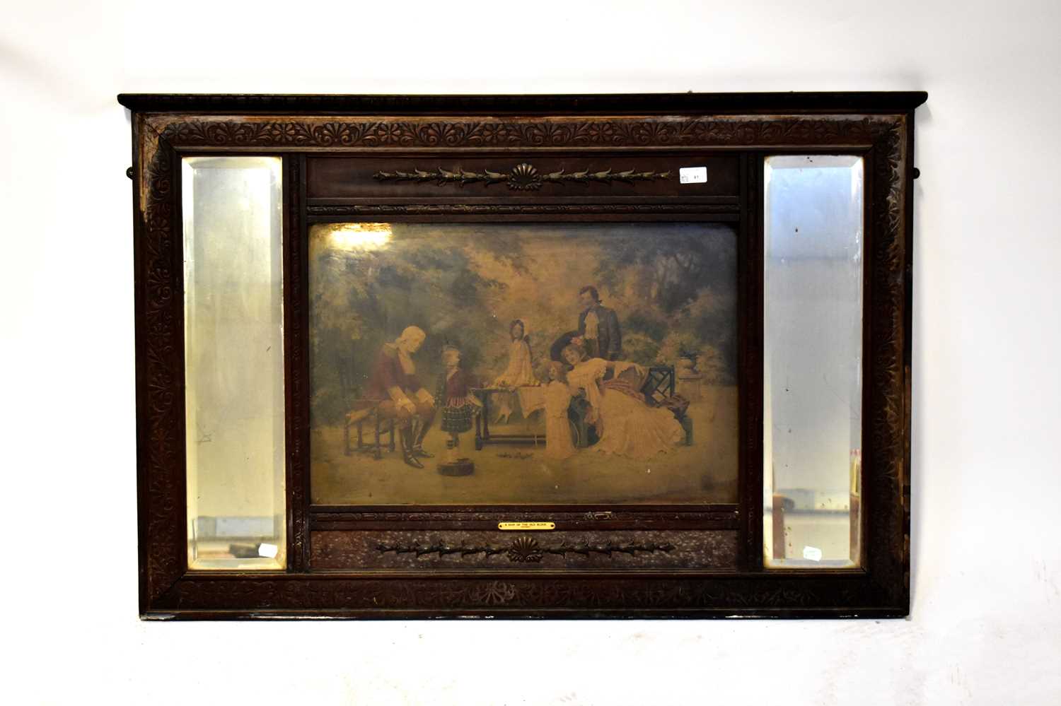 An Edwardian mahogany over mantel mirror with central panel with print titled 'A Chip off the Old